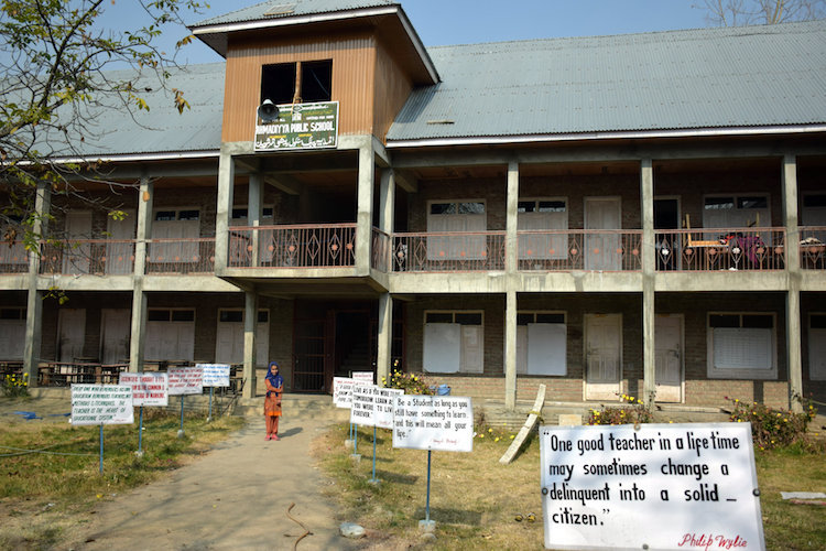 Photo: Placards, stressing the need of education and peace adorn the frontyard of a school run by the Ahmadiyya community in Reashinagar village in Shopian district of southern Kashmir (India). Credit: Stella Paul | IDN-INPS