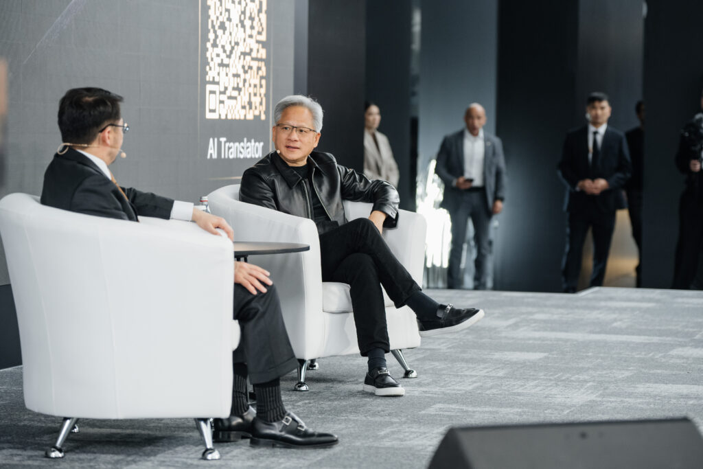 NVIDIA CEO Jensen Huang (right) discusses Kazakhstan’s AI ambitions with Zhaslan Madiyev, the country’s deputy prime minister and minister of artificial intelligence and digital development, at alem.ai in Astana on October 23, 2026. | Photo: Astana Hub.