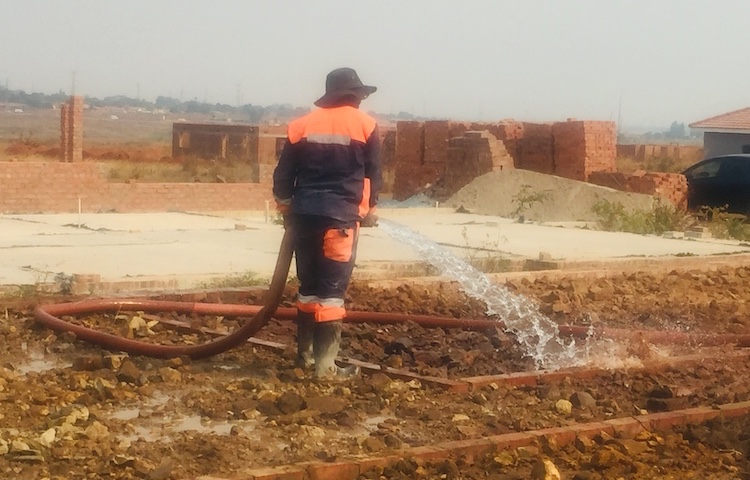 Photo: In Harare, the Zimbabwean capital’s medium density suburb called Glaudina west of the city, where a thick forest used to exist about a decade ago, under construction, hordes of homes are emerging instead as trees have vanished. Credit: Jeffrey Moyo | IDN