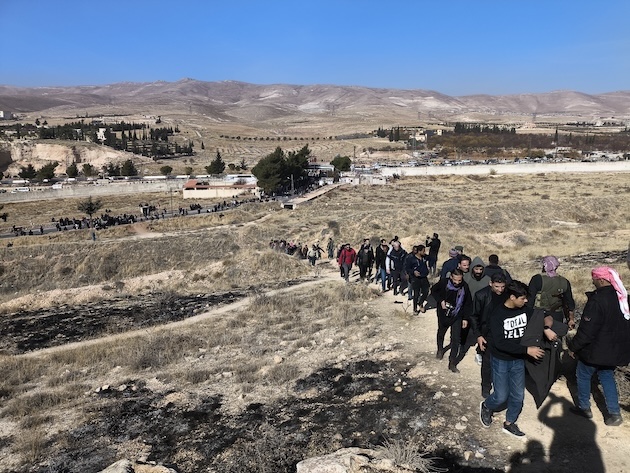 The people walk to Saydnaya prison to search for the detainees. Credit: Abdul Karem al-Mohammad/IPS