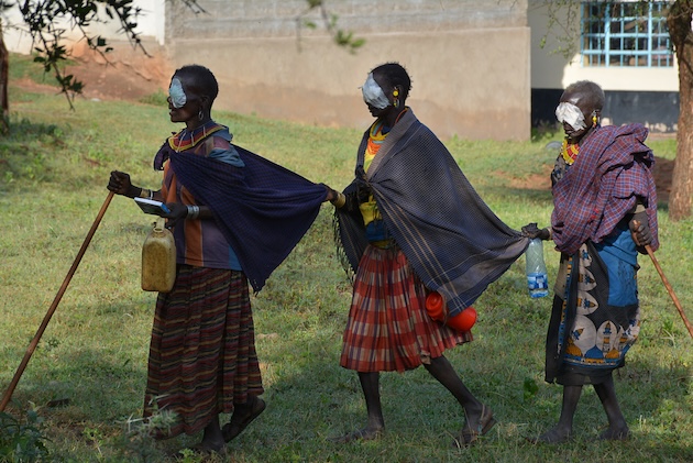 Turkana women recover with white bandages over their eyes after undergoing surgery to treat trachoma, the world's leading cause of blindness. Efforts like these are crucial in preventing the spread of this debilitating disease in vulnerable communities. Credit: Robert Kibet/IPS