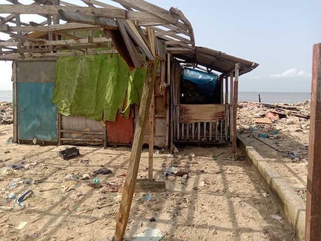 The ruins of buildings stand as silent witnesses to the relentless sea surge. Credit: Promise Eze/IPS