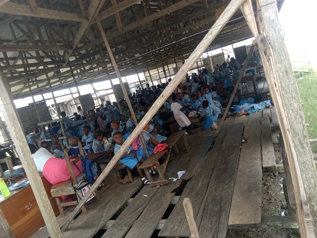 The community’s only remaining school, a fragile makeshift structure, has been repeatedly relocated due to relentless sea surges. Credit: Promise Eze/IPS