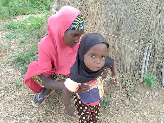 Zainab Abdul and her two-year-old daughter at a refugee camp in Zamfara, northwest Nigeria. Credit: Promise Eze/IPS