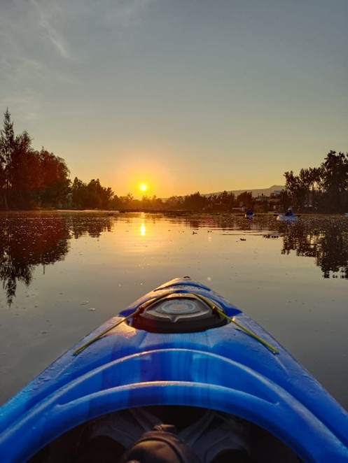 Photo: Sunrise aboard a kayak in Xochimilco. Credit: Guillermo Ayala Alanis.